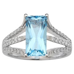 Blue topaz and diamond ring