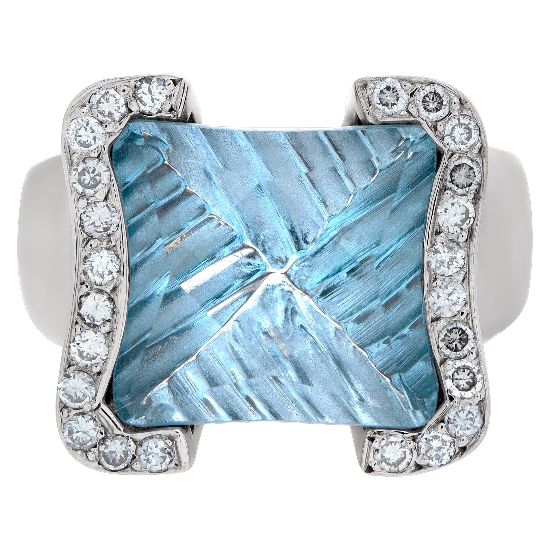 Feather cut blue topaz and diamond ring in 18k white gold with approximately 0.24 carats in diamonds. Size 6.25.

This Topaz ring is currently size 6.25 and some items can be sized up or down, please ask! It weighs 7.7 pennyweights and is 18k.