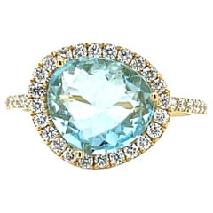 Bague en or jaune 18k avec topaze bleue et diamant