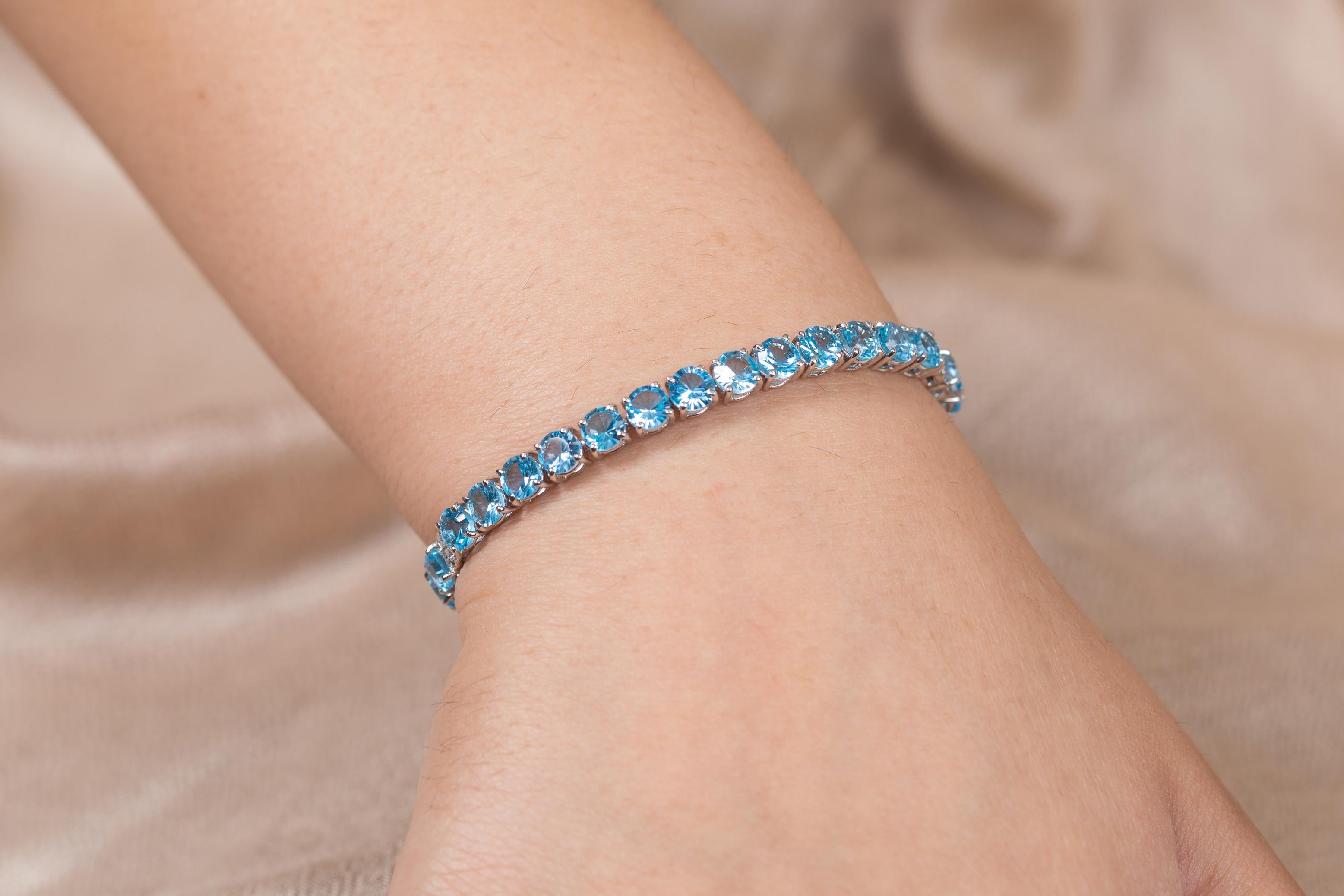 Modern Blue Topaz and Diamond Tennis Bracelet in 18K White Gold