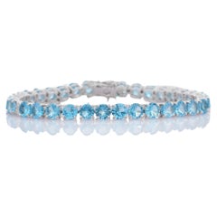 Blue Topaz and Diamond Tennis Bracelet in 18K White Gold