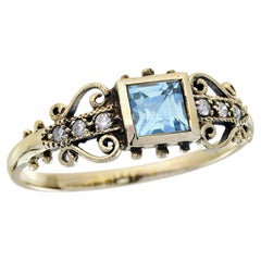 Bague filigrane de style vintage en or jaune 9 carats massif avec topaze bleue et diamants
