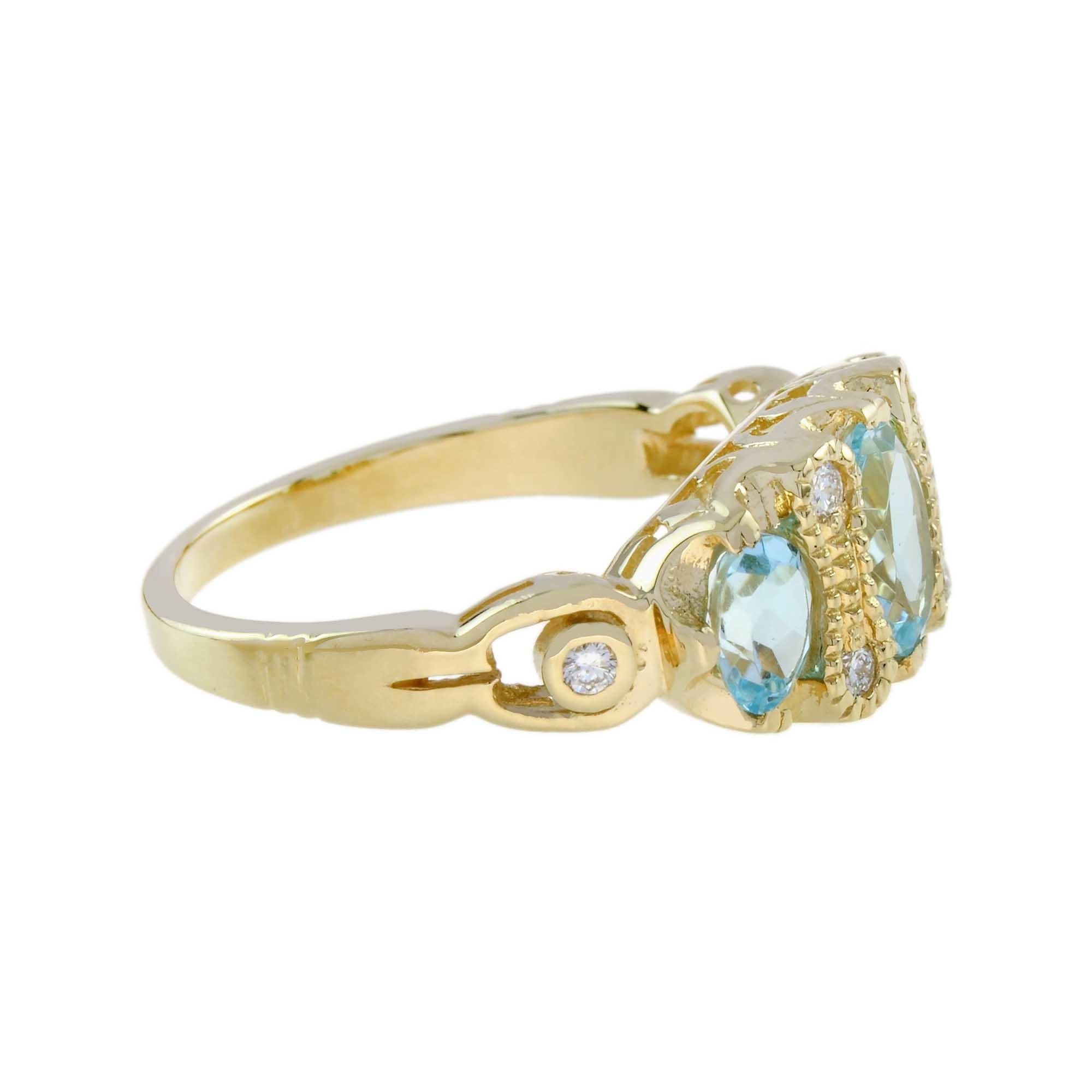 Im Angebot: Dreisteinring aus 9 Karat Gelbgold mit blauem Topas und Diamant im Vintage-Stil () 4