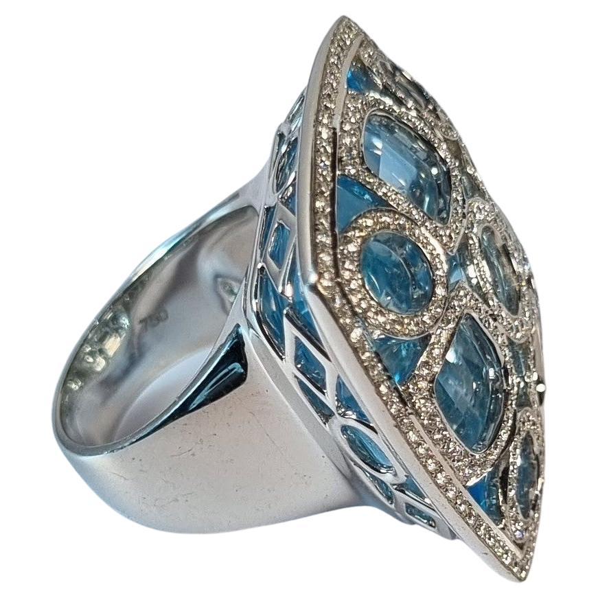 Blauer Topas und Geometrie der Diamanten in 18k Weißgold Ring