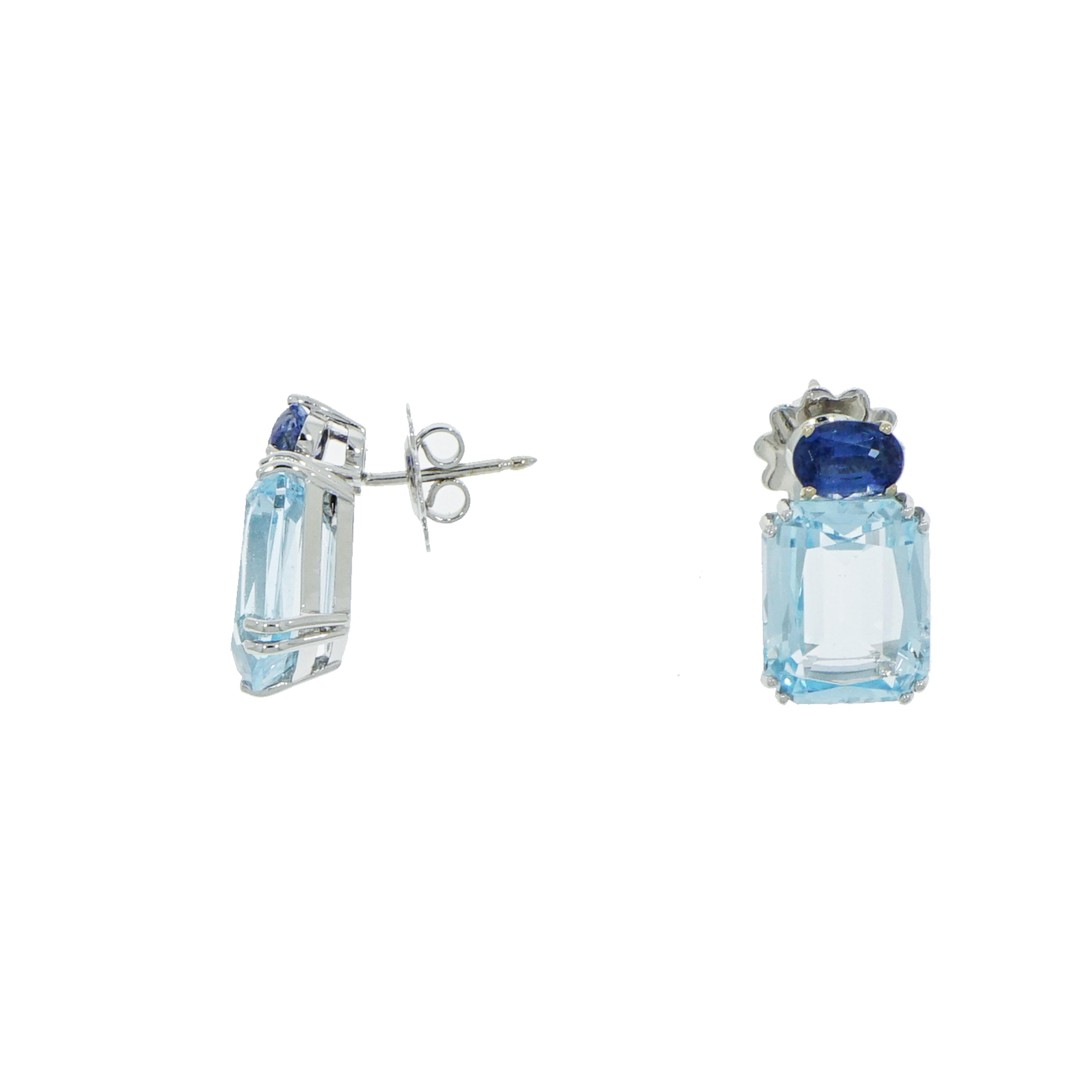 Inspired by the bright colors of summer and the essential lines of modern architecture, translated into the bold emerald cut center stone with oval accent.  
This Blue Topaz and Kyanite earrings are mesmerizing... Designed by Carlo Antonini and