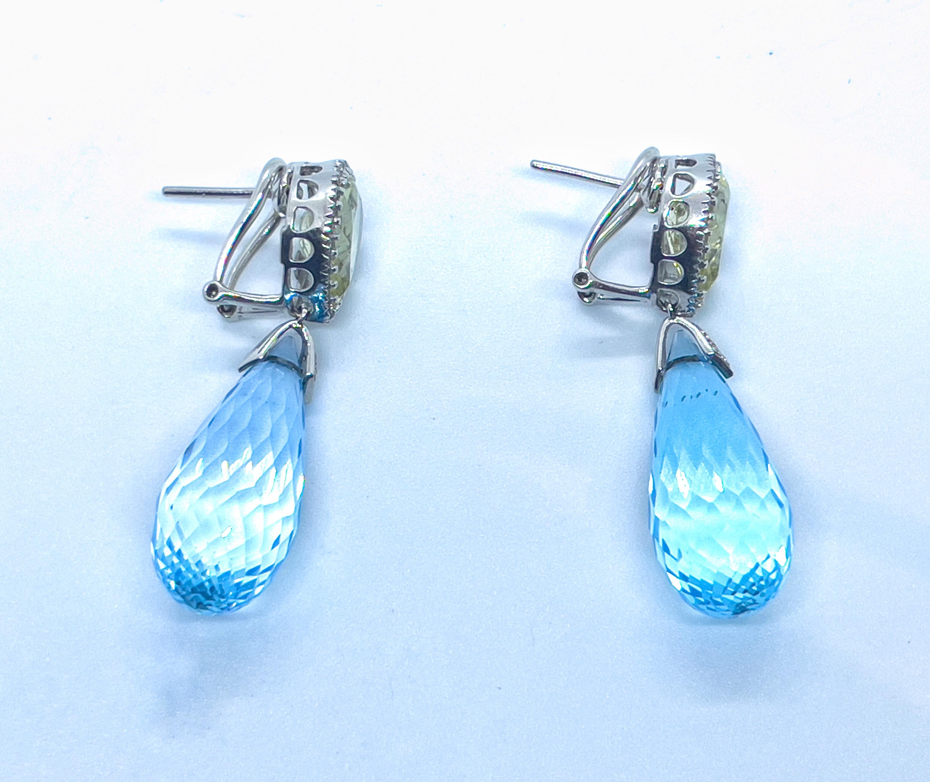 Stunning Blue Topaz and Lemon quartz earrings. The stones are surrounded by round-cut white diamonds. The earrings are made of 18K white gold. Each topaz weighs approximately 14 carats.

breath taking experience. not flashy, but it showed you mental