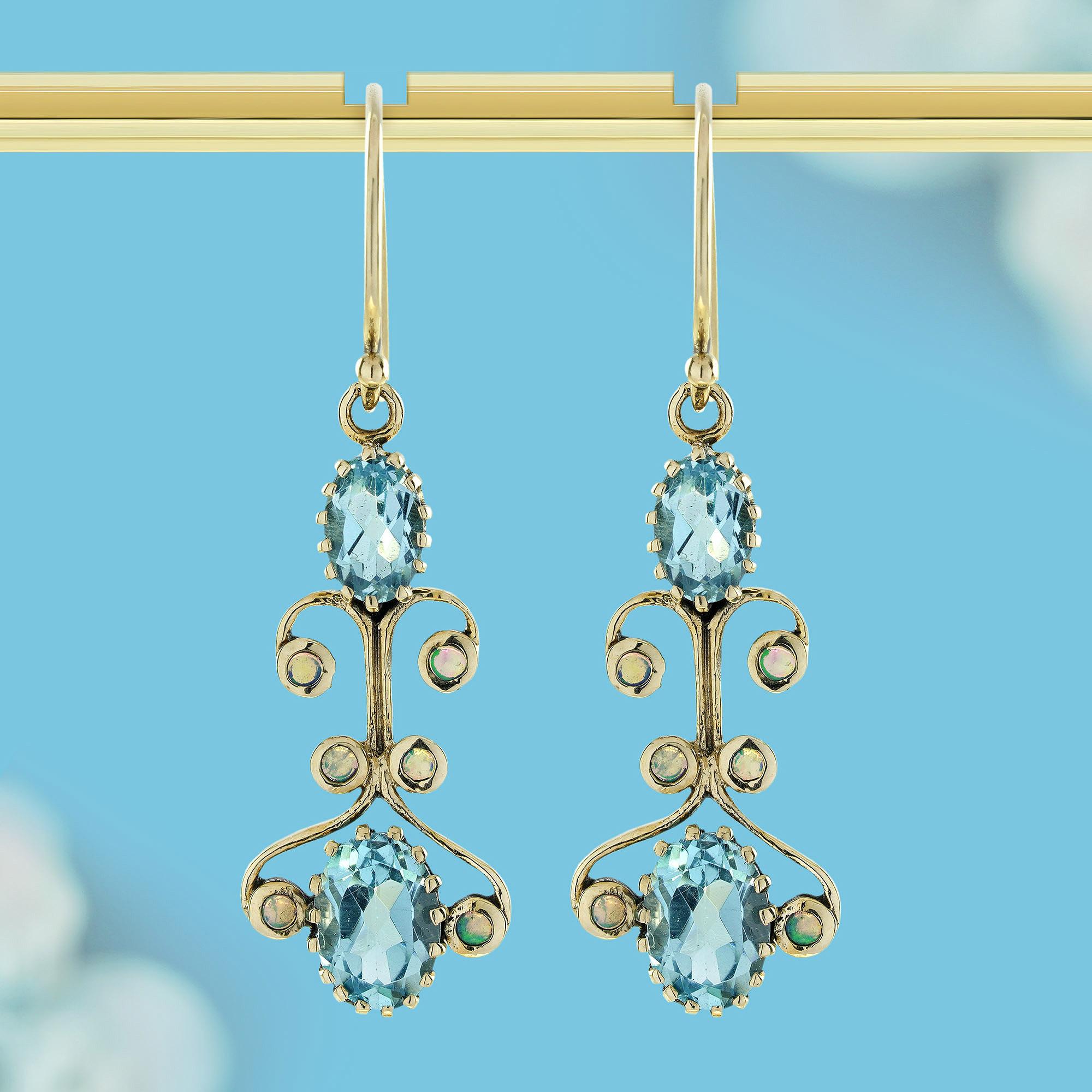 Lasciati conquistare dall'incantevole fascino di questi orecchini a pendente in stile vittoriano in topazio blu naturale, un capolavoro realizzato in oro massiccio 9 carati. Il blu chiaro e ipnotico del topazio danza con la luce, creando un'eleganza