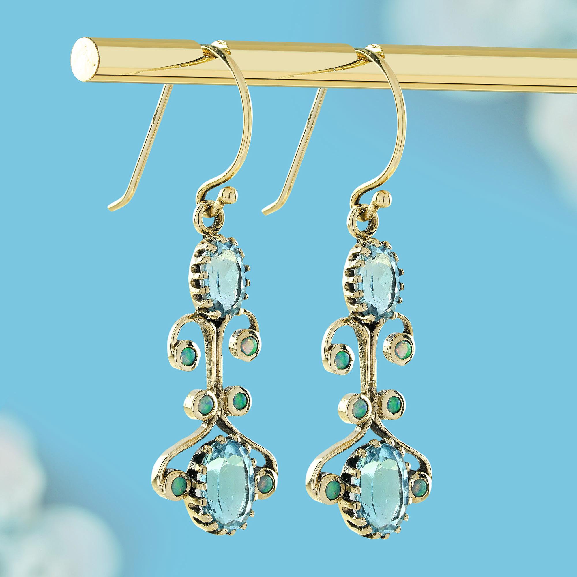 Oval Cut Blue Topaz and Opal Victorian Style Dangle Earrings in Solid 9K Gold For Sale
