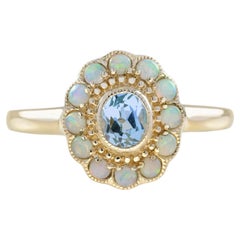 Blue Topaz and Opal Vintage Style Floral Halo Ring in 9K Yellow Gold