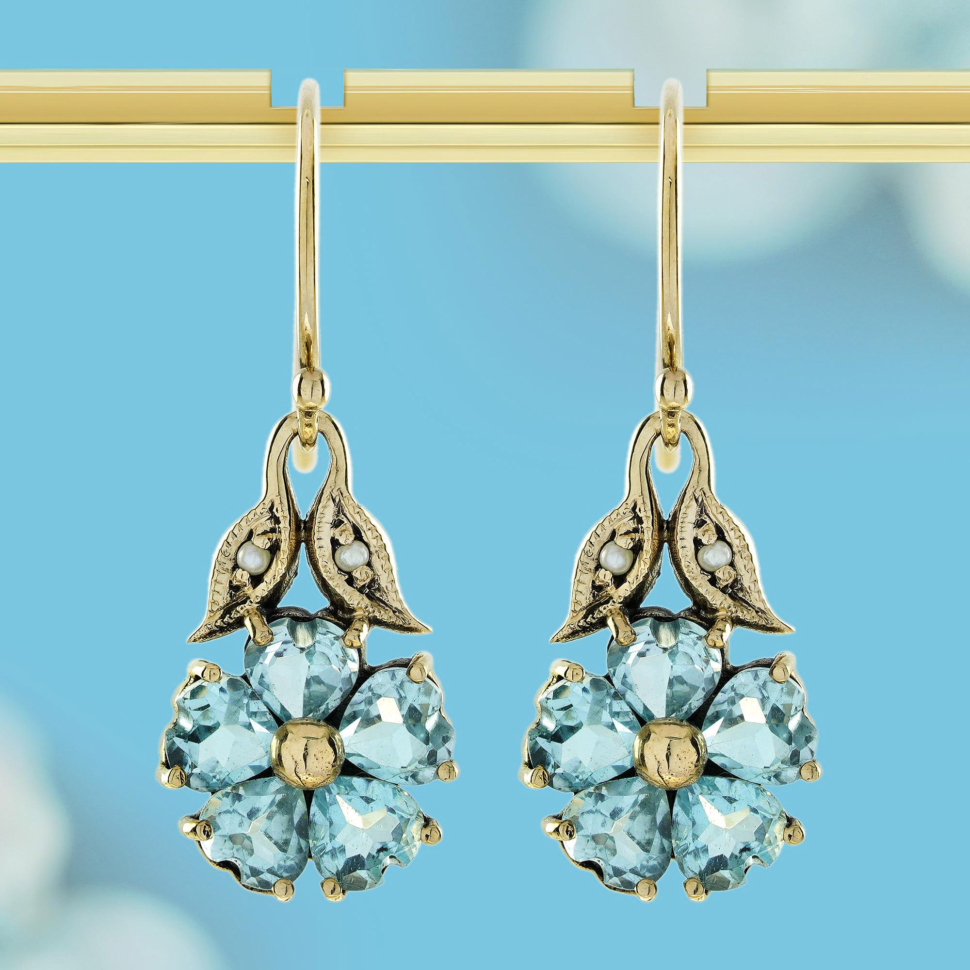 Illuminate your style with our Natural Blue Topaz and Pearl Vintage Style Cluster Earrings, crafted in Solid 9K Gold. These enchanting earrings feature a lustrous pearls at the center, surrounded by stunning blue topaz, creating a perfect blend of