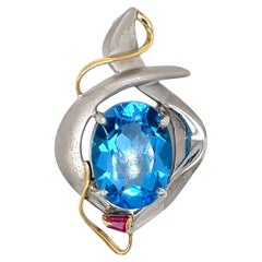 Blue Topaz and Ruby Pendant in Sterling Silver and 14 Karat Gold