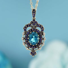 Blue Topaz and Sapphire Crown Pendant  in 9K Yellow Gold