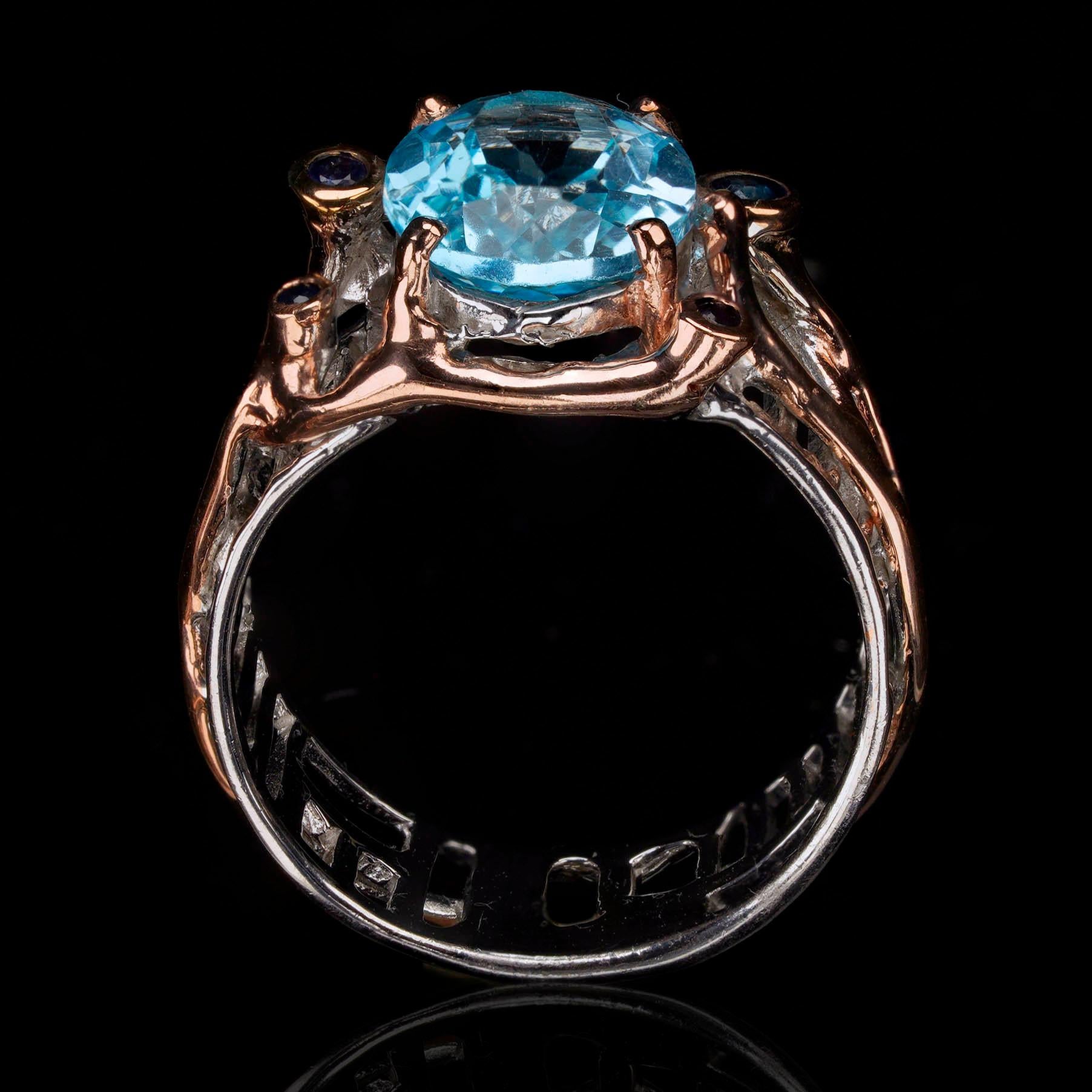 Oval Cut Blue Topaz and Sapphire Ring For Sale