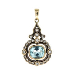 Topaze bleue et saphir blanc Pendentif de style Art Déco en or jaune 9k