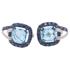Blue Topaz, Blue Sapphire, and Diamond ER's in 14 Karat White Gold