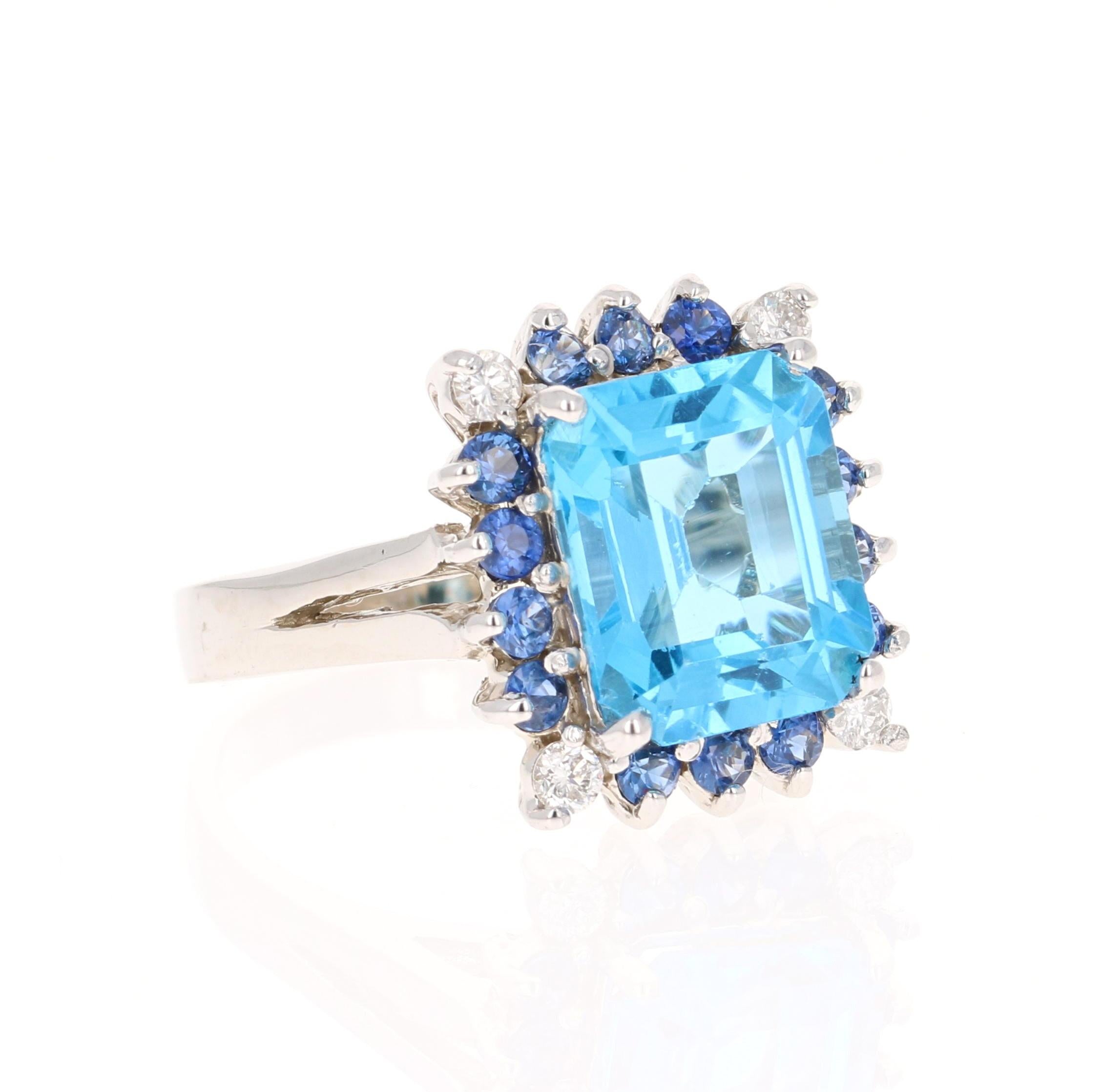 This ring has a Emerald Cut Blue Topaz that weighs 5.65 carats and 14 Blue Sapphires that weigh 0.64 carats and 4 Round Cut Diamonds that weigh 0.24 carats. The total carat weight of the ring is 6.53 carats. 

The Blue Topaz measures at