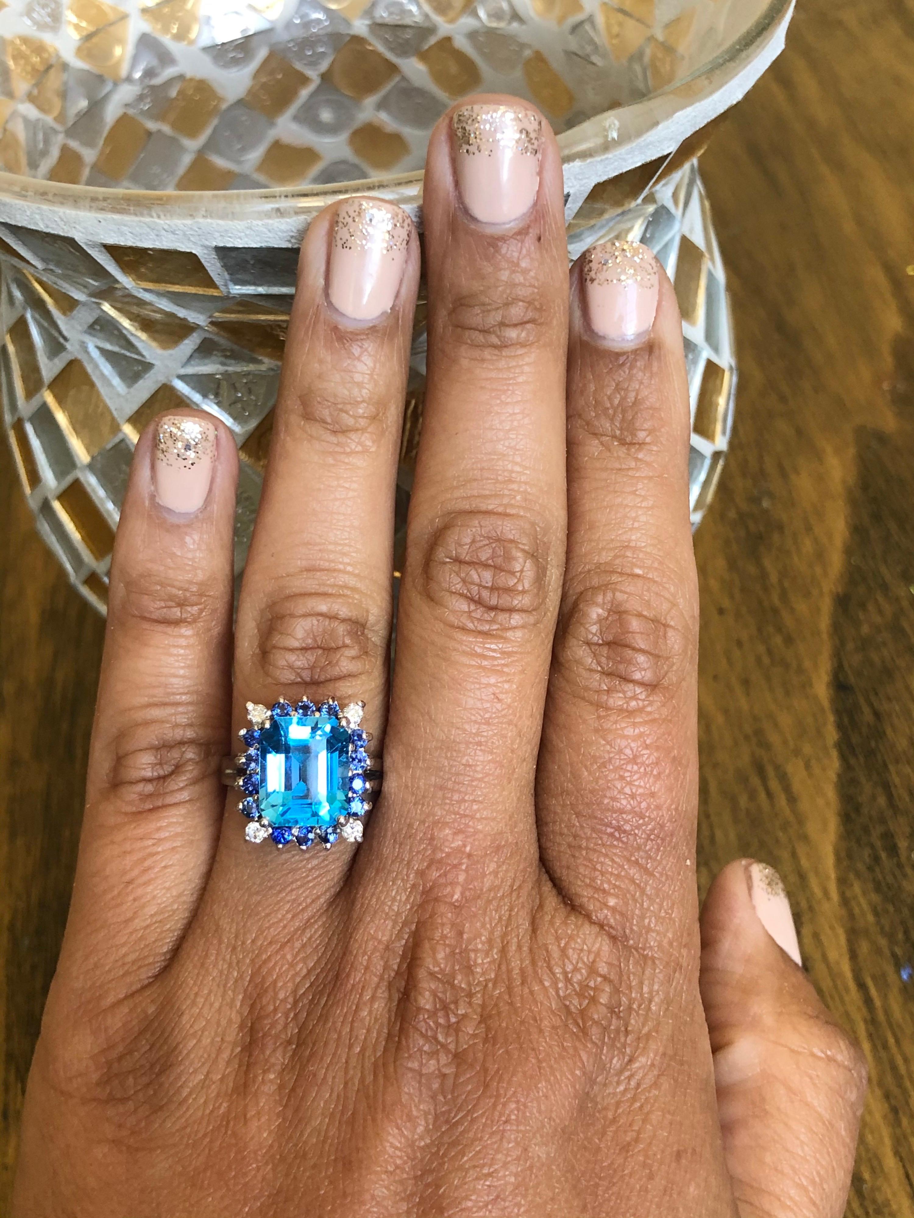 14k gold diamond ring with white topaz and blue sapphire.
