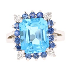 Bague en or blanc 14 carats avec topaze bleue, saphir bleu et diamant