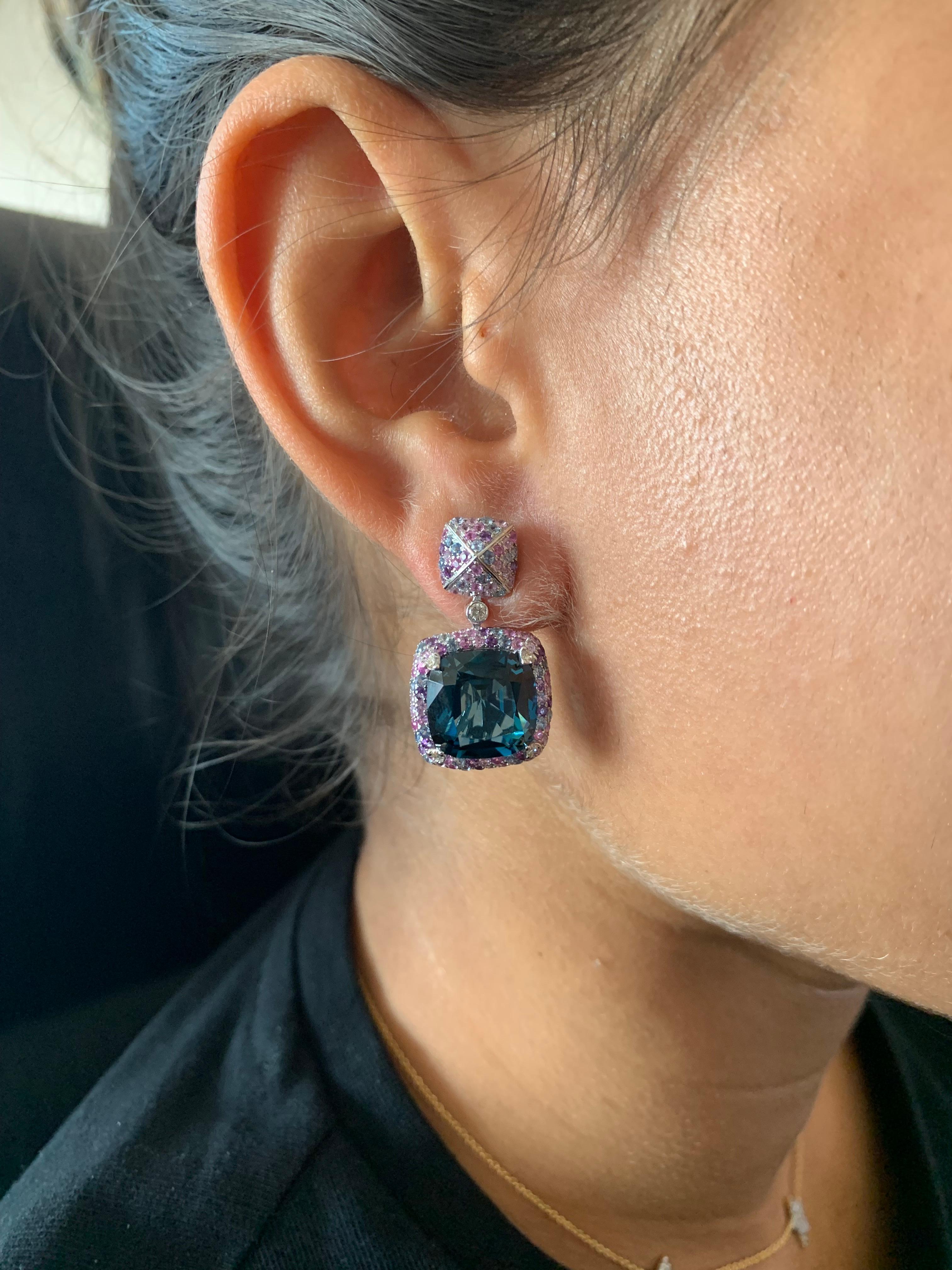 Bold Blue Topaz! Light and easy to wear these earrings showcase deep blue topaz accented with a multi color gemstone and diamond frame. These earrings are dainty yet have a great pop of color from the vibrant gems.

Blue Topaz Candy Earrings with