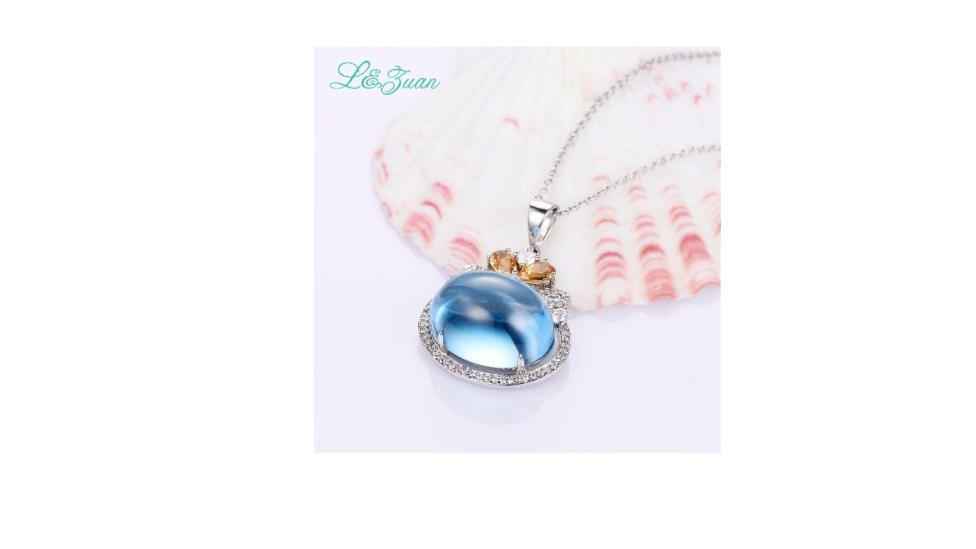 This large  unique Blue Topaz  stands out with the Citrine and accent  stones at the top and will make a ideal gift too. And its set in sterling silver 

28X20MM