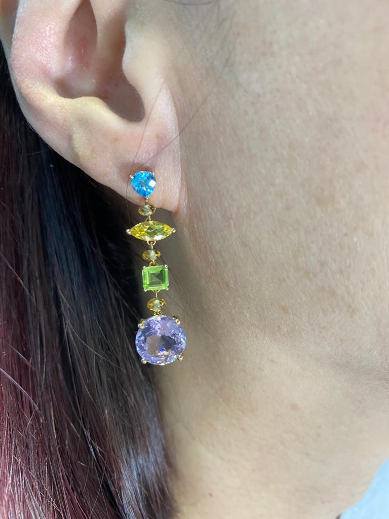 This earrings feature 2 blue topaz weight 1.06 carat, 6 citrine weight 1.15 carats, 2 peridot weight 1.09 carats, 2 yellow beryl weight 0.94 carat, 2 amethyst weight 6.85 carats. Earrings are set in 14 karat yellow gold. 
Length 1.55 inch
Blue topaz