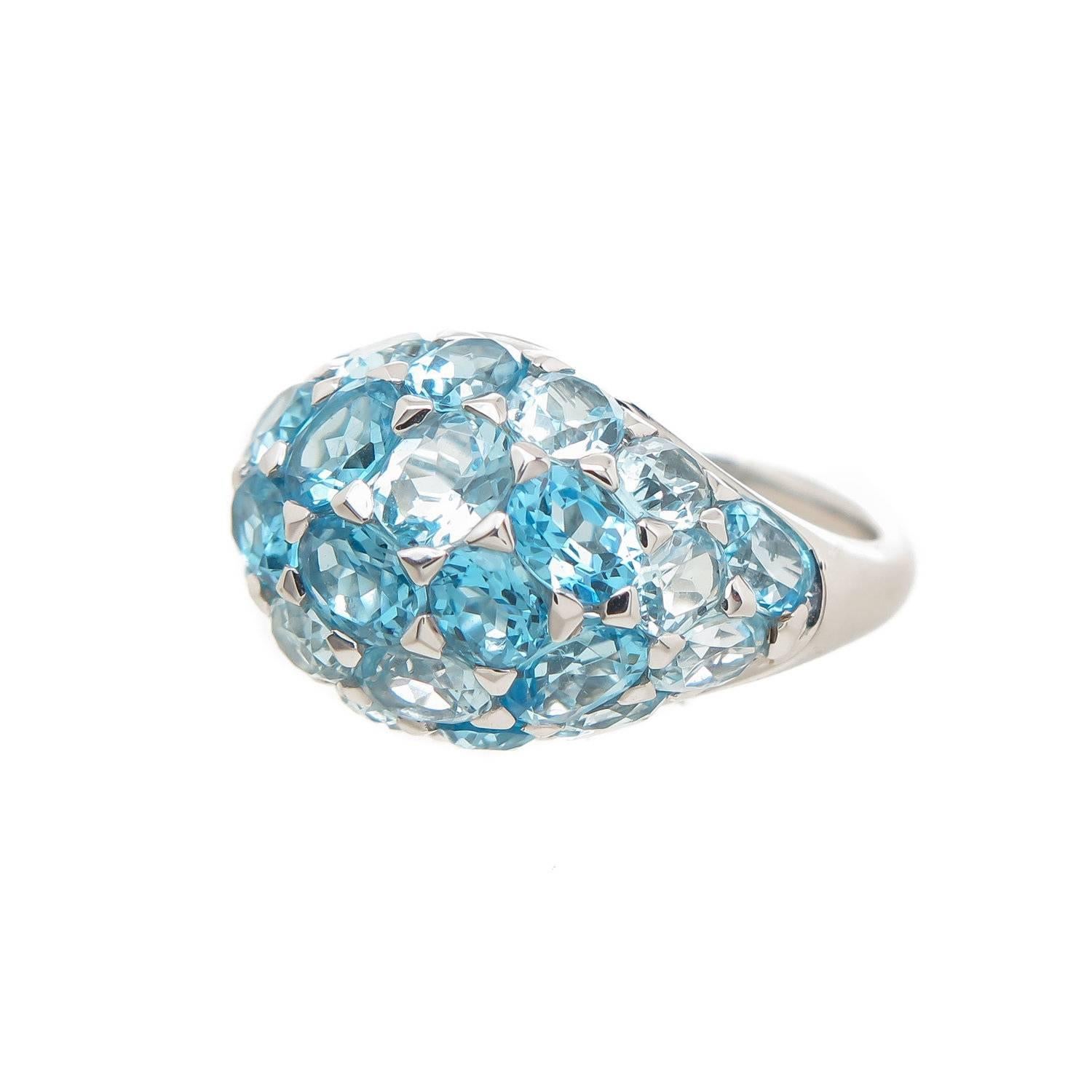 Multi color blue topaz ring , with oval shaped topazes in hand picked several blue shades offering a lustrous look. Topazes weighing approx 7.13cts , set in 18k white gold.
Ring can be sized 1 size up or down. This ring is size 5 3/4 .
