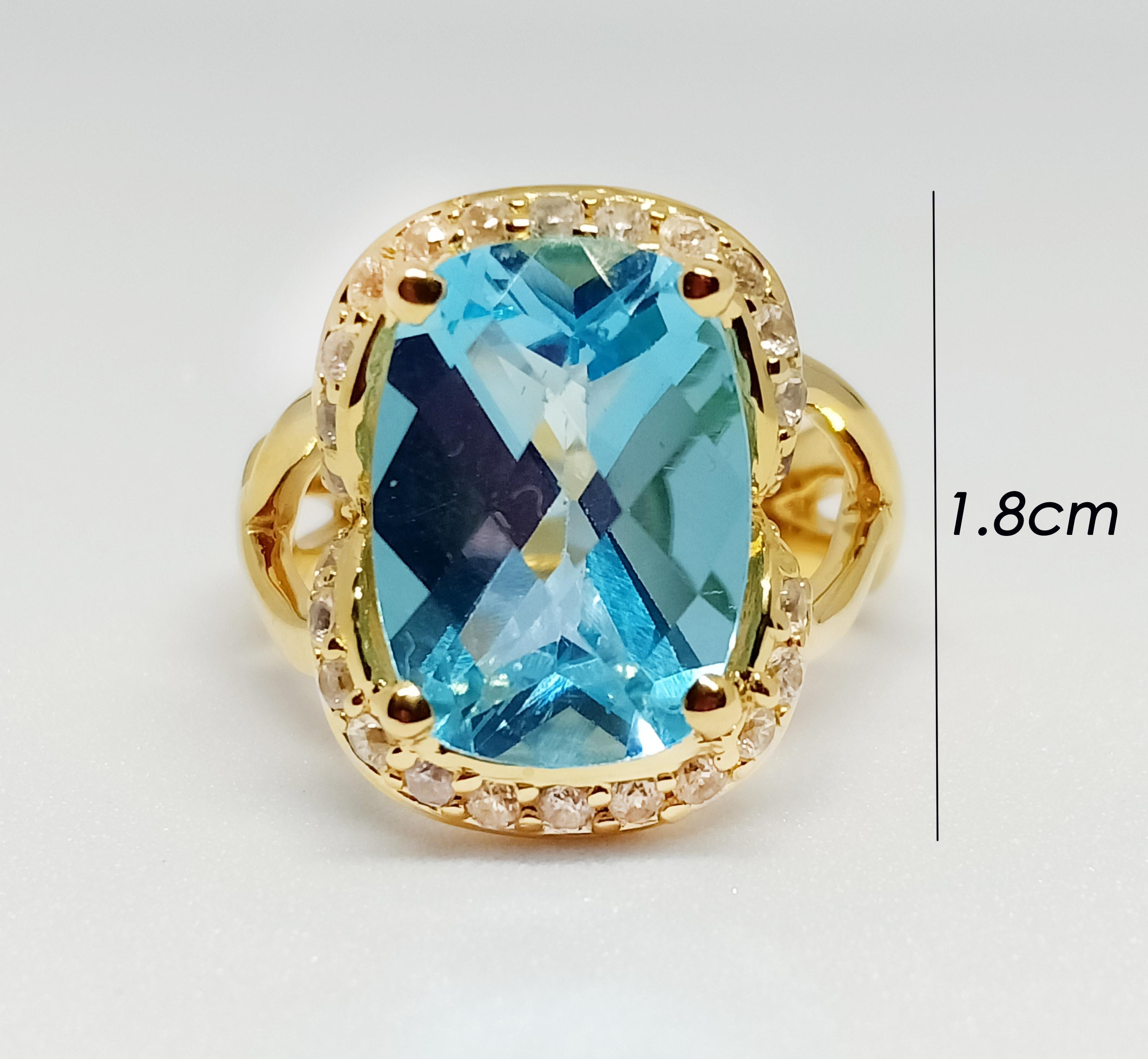 Blue topaz cushion checkerboard size 14x10mm.  7.60cts
White Zircon 26 pcs. Pave setting
18K Gold Plated over stering silver 925
Cocktail ring. 

