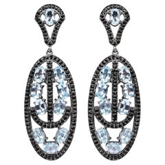 Orecchini pendenti di topazio blu con spinelli neri 13,9 carati in argento rodiato