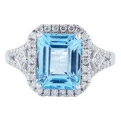 Bague en or 18 carats avec topaze bleue et diamant