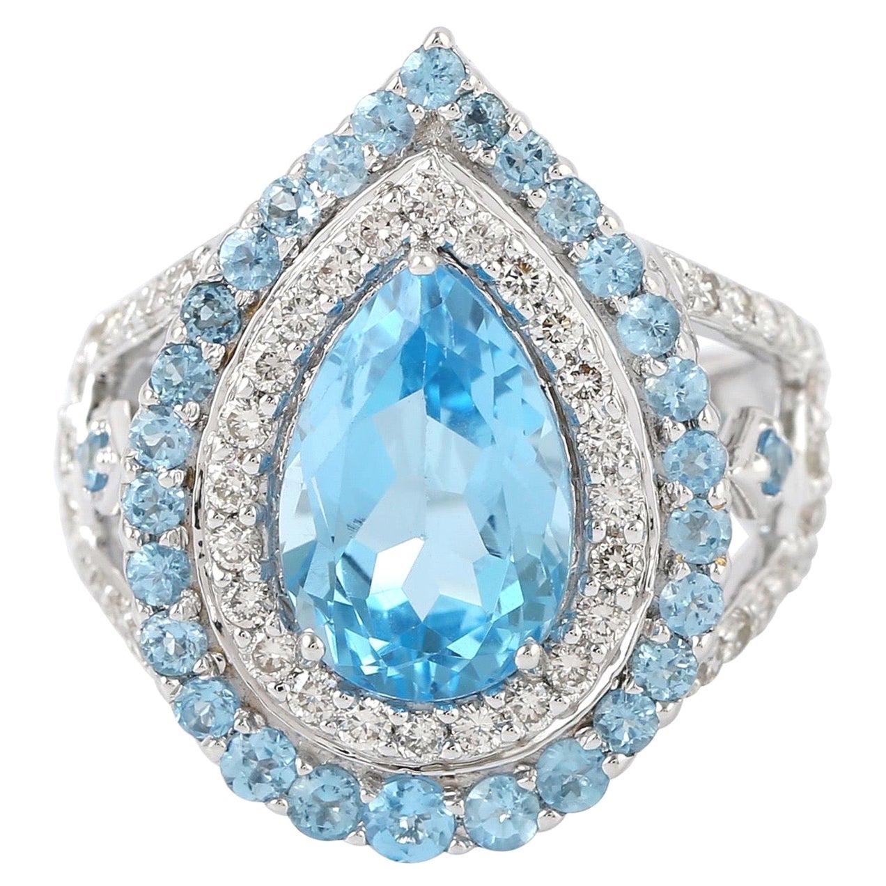 Bague en or 18 carats avec topaze bleue et diamants