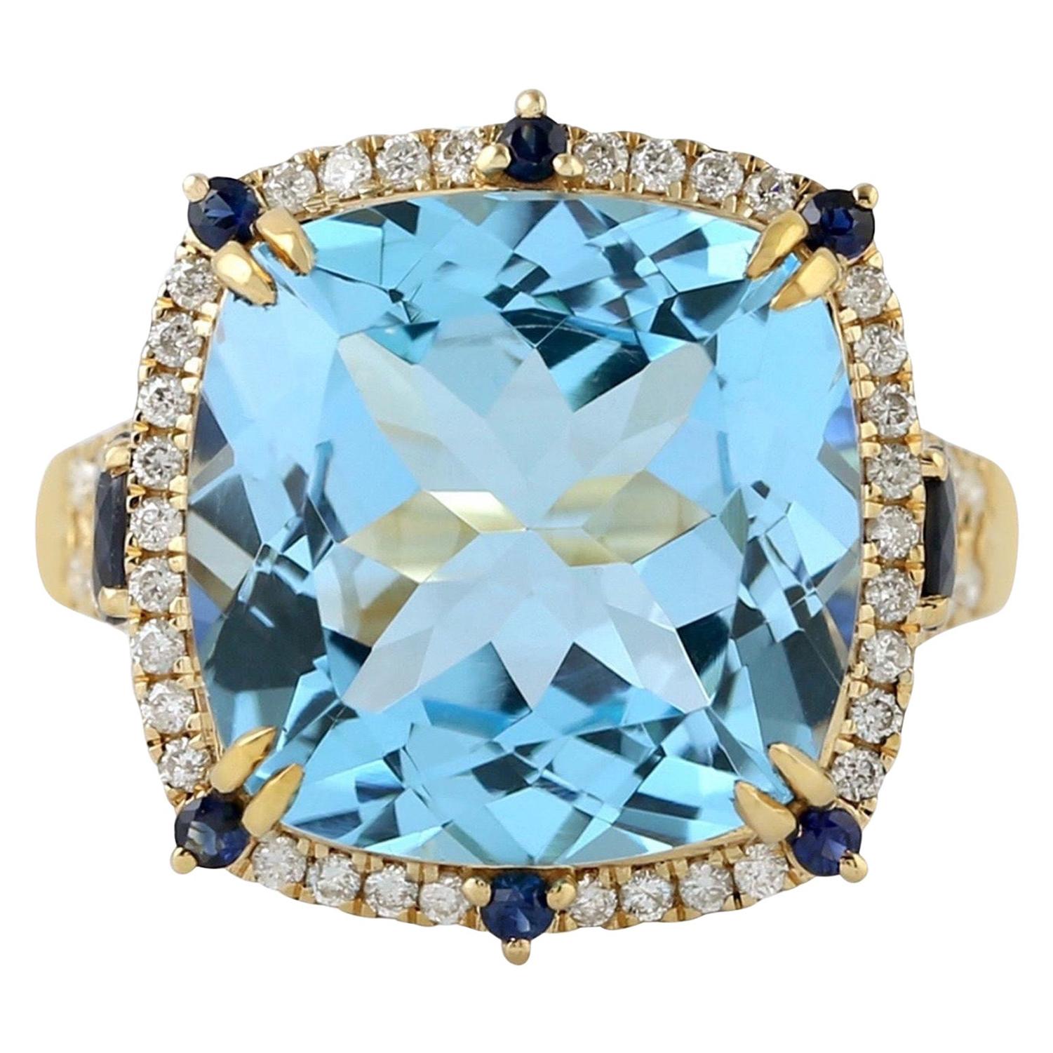 Bague en or 18 carats avec topaze bleue et diamants