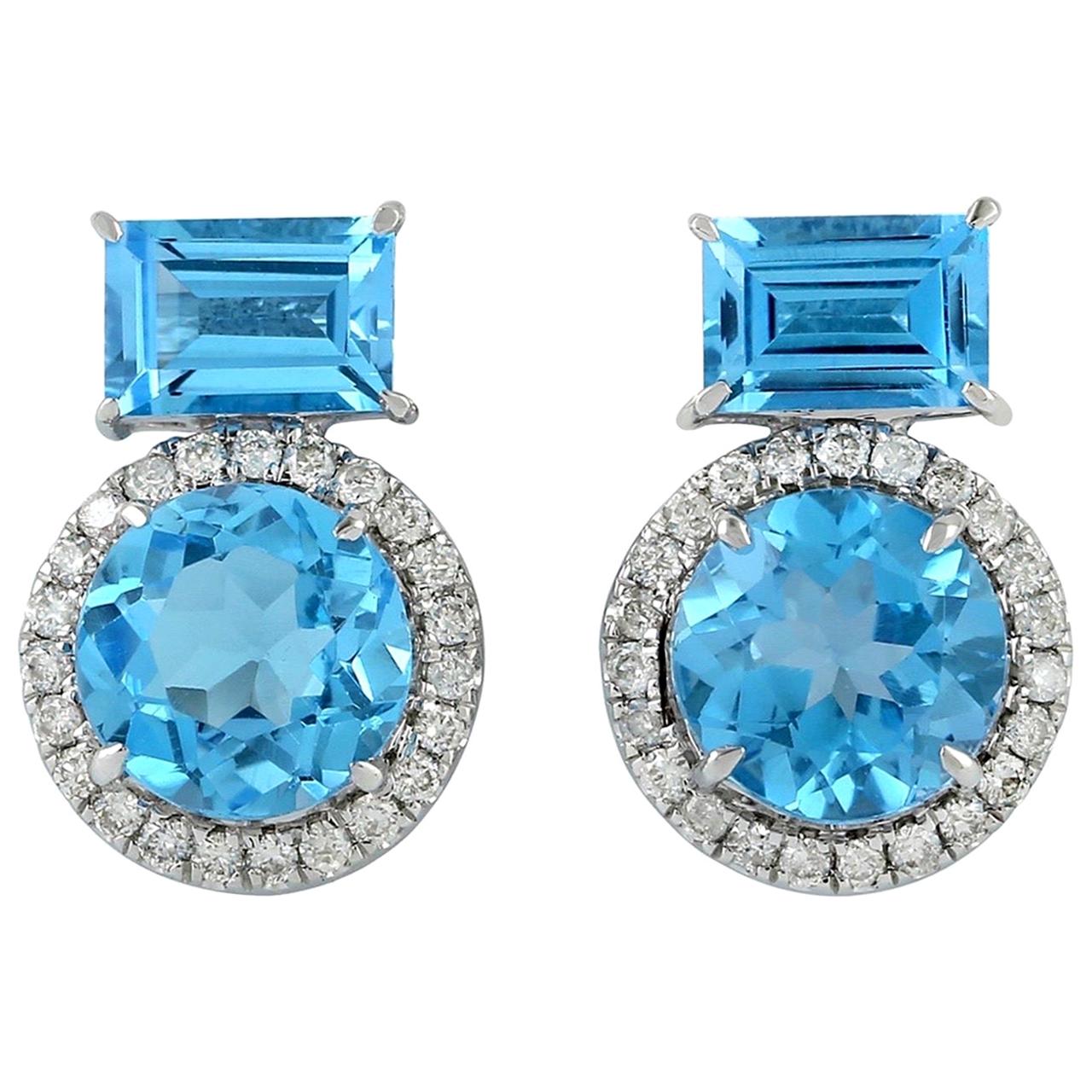 Clous d'oreilles en or 18 carats avec topaze bleue et diamants