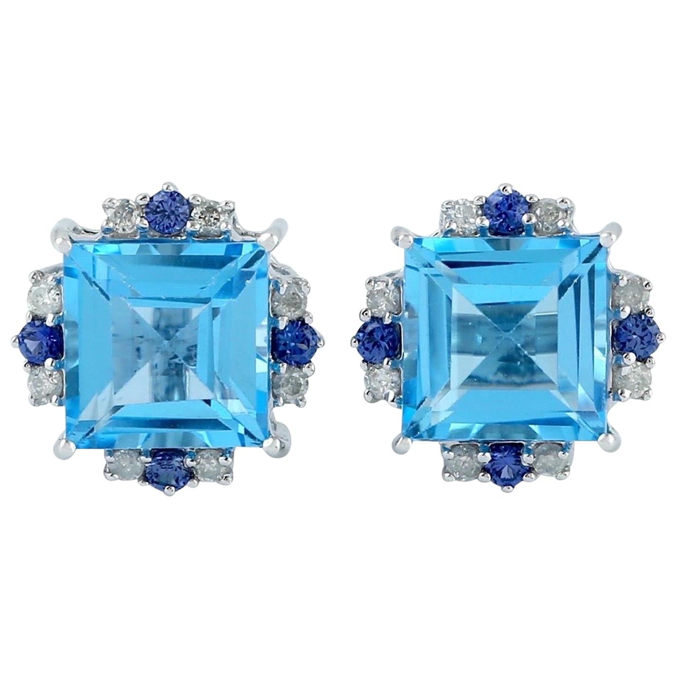 Clous d'oreilles en or 18 carats avec topaze bleue et diamants