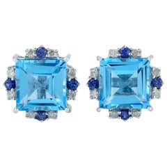 Pendientes de oro de 18 quilates con diamante y topacio azul