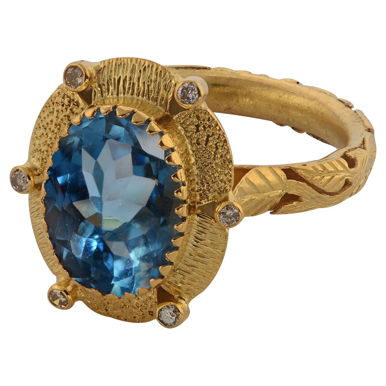 Anello da cocktail in oro 18k con diamante e topazio blu