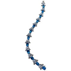 Blue Topaz and Diamond Affordable Tennis Bracelet 14 Karat White Gold, 7 Inch