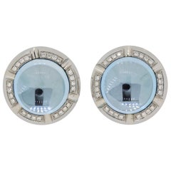 Orecchini a bottone in oro con diamante e topazio blu