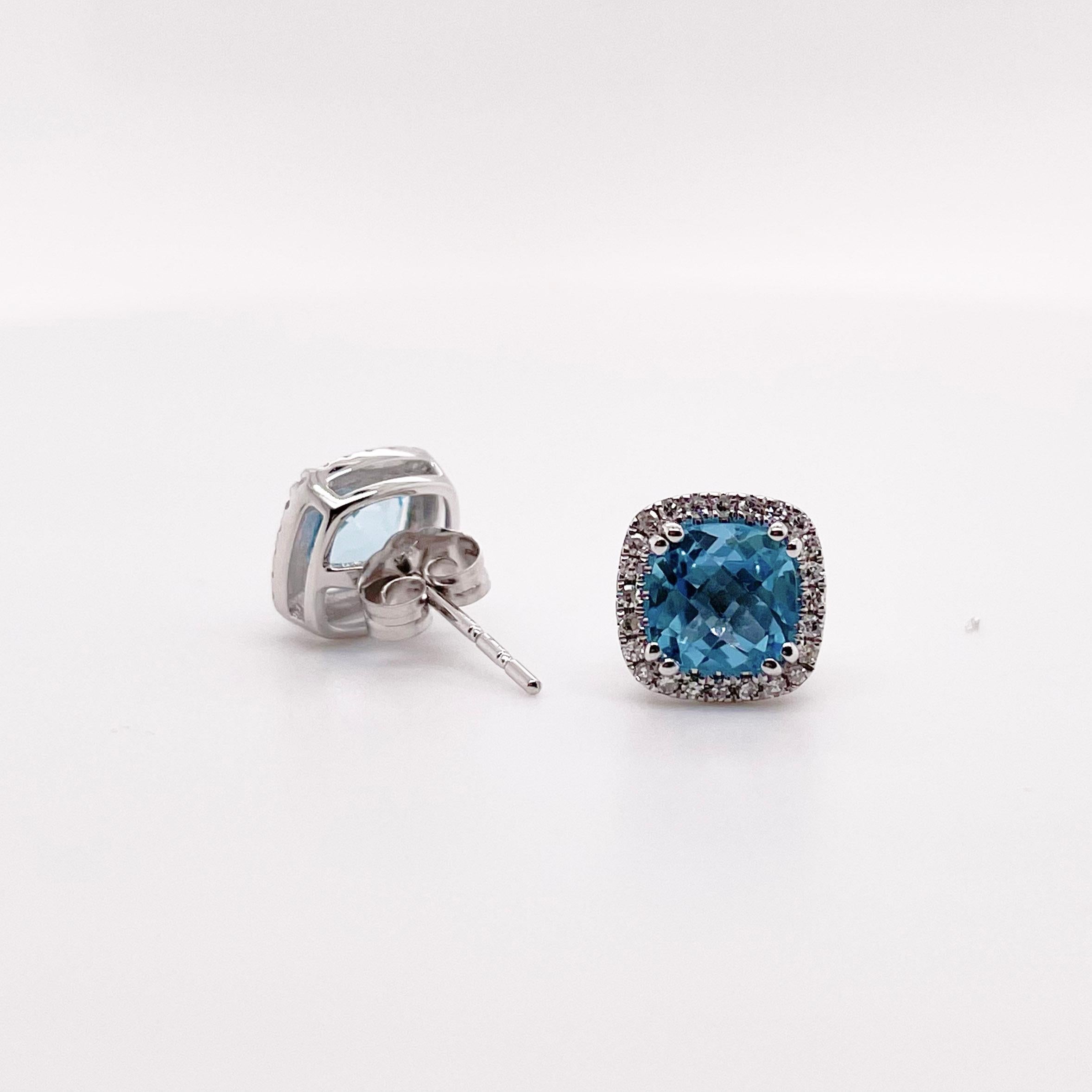 These gorgeous Swiss blue topaz earrings are accented with a halo of diamonds.  These earrings are the perfect size to wear everyday! Swiss blue is the most popular color for topaz as it is a nice pop of color with anyone’s hair! Each earring has 24