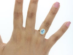 Blue Topaz Diamond Halo Ring