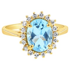 Bague halo en topaze bleue et diamant