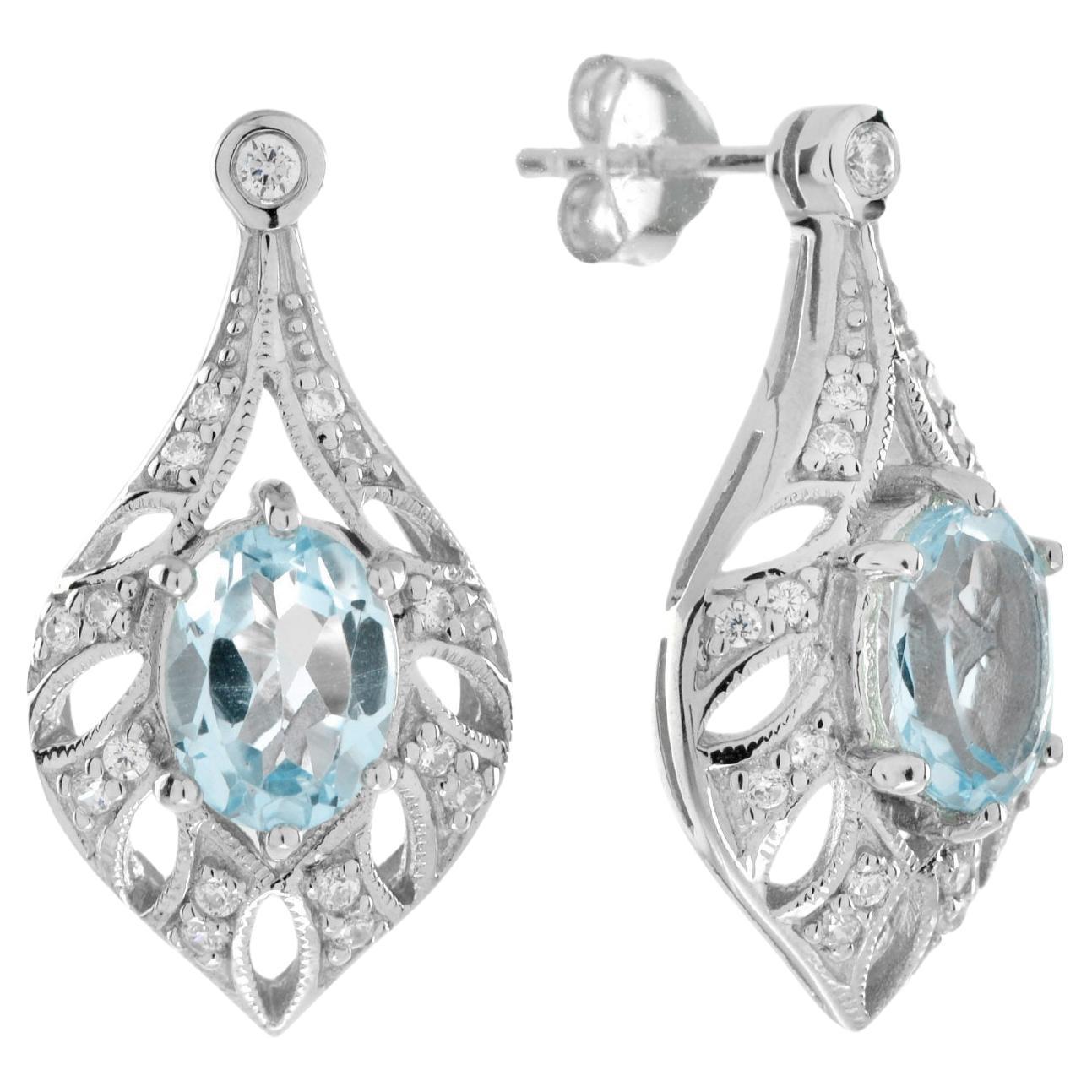 Boucles d'oreilles pendantes en or blanc avec topaze bleue et diamant en forme de cadre ajouré de style Art déco en vente