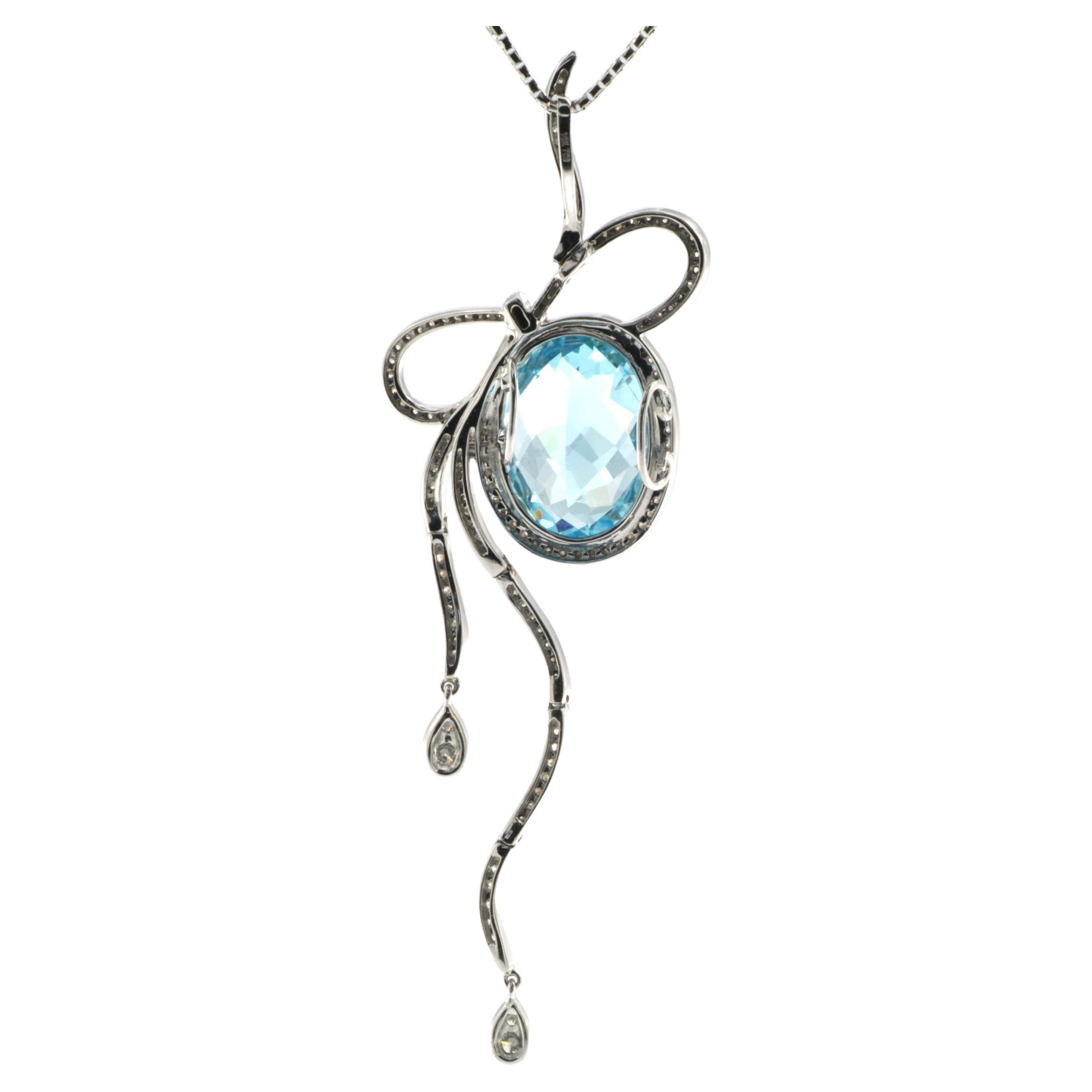 Contemporain Pendentif ruban en or blanc 18 carats avec topaze bleue et diamants en vente