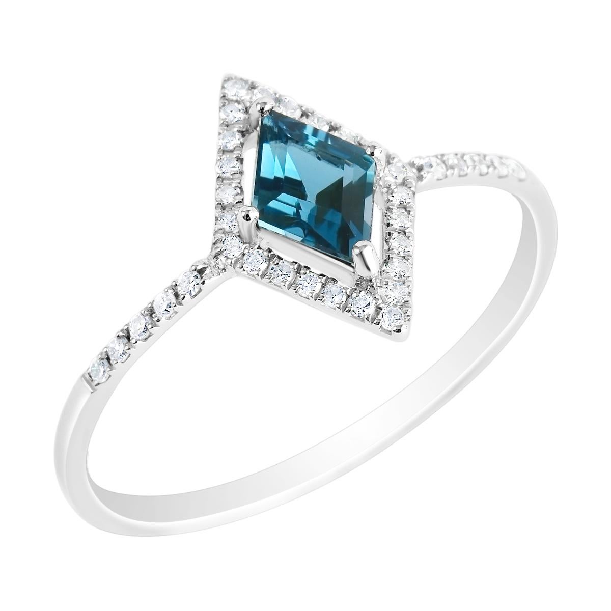 An EK Designs original this bold and distinctive ring features an alluring London blue topaz gemstone adorned with 34 sparkling diamonds. The 0.50 carat natural kite cut blue topaz is a velvety rich London blue in colour with a lovely hue and