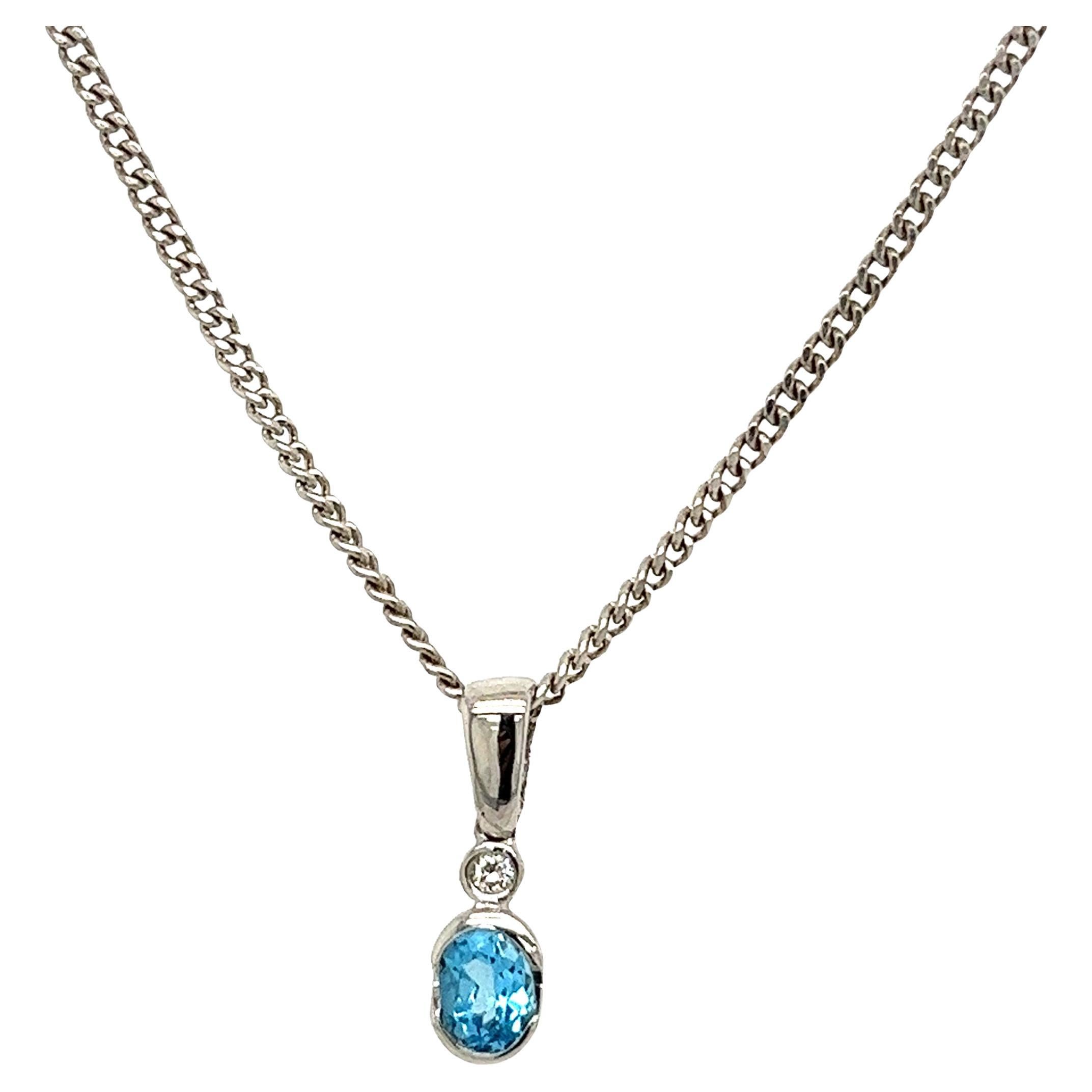 Pendentif solitaire en or blanc 18 carats, topaze bleue et diamants