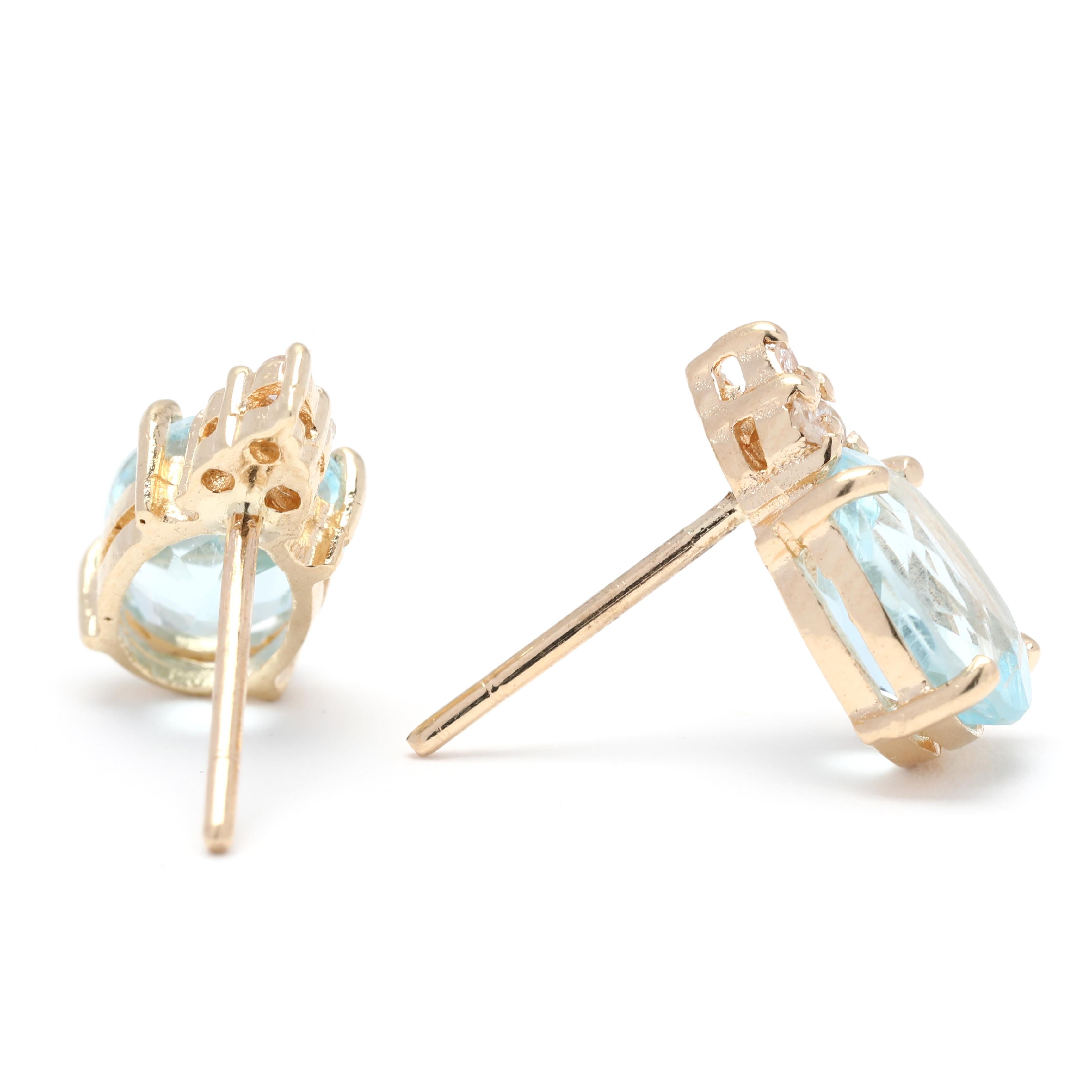 These stunning blue topaz diamond stud earrings are a beautiful and elegant accessory for any occasion. Crafted in 14K yellow gold, the earrings feature two 1.62 carat blue topaz stones, totaling 3.25 carats. The oval-shaped topaz stones are