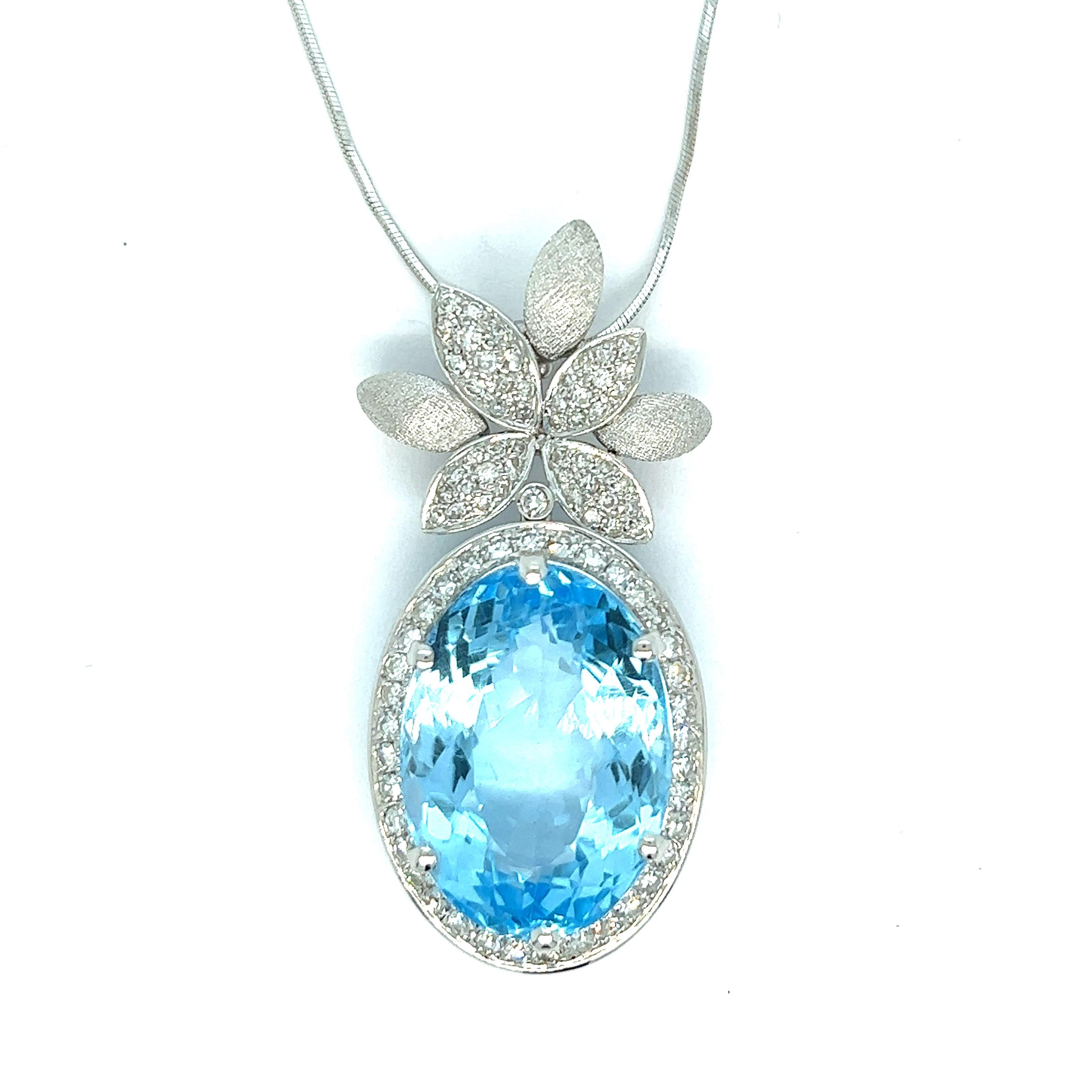 Blue topaz and diamonds pendant necklace, made in Italy

Oval shaped blue topaz of around 25-30 carats (17x23 mm), round-cut diamonds of 2 carats, 18 karat white gold; marked 750 

Size: pendant width 0.88 inch, length 2 inches; chain length 18
