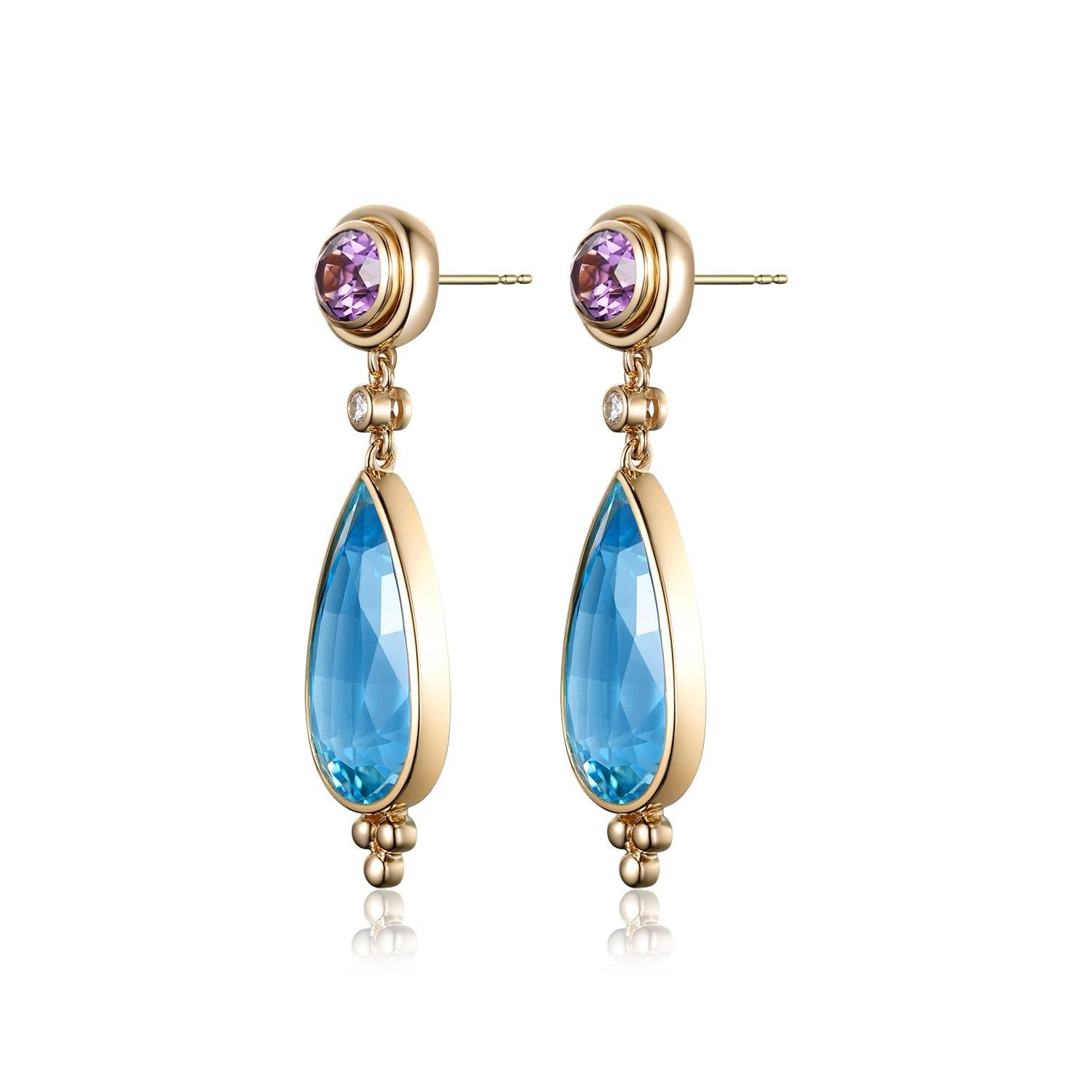 These stunning earrings showcase a beautiful combination of blue topaz, amethyst, and diamonds, all set in 14 karat yellow gold.

The centerpiece of the earrings is the two magnificent blue topaz gemstones, which collectively weigh 33.04 carats. The