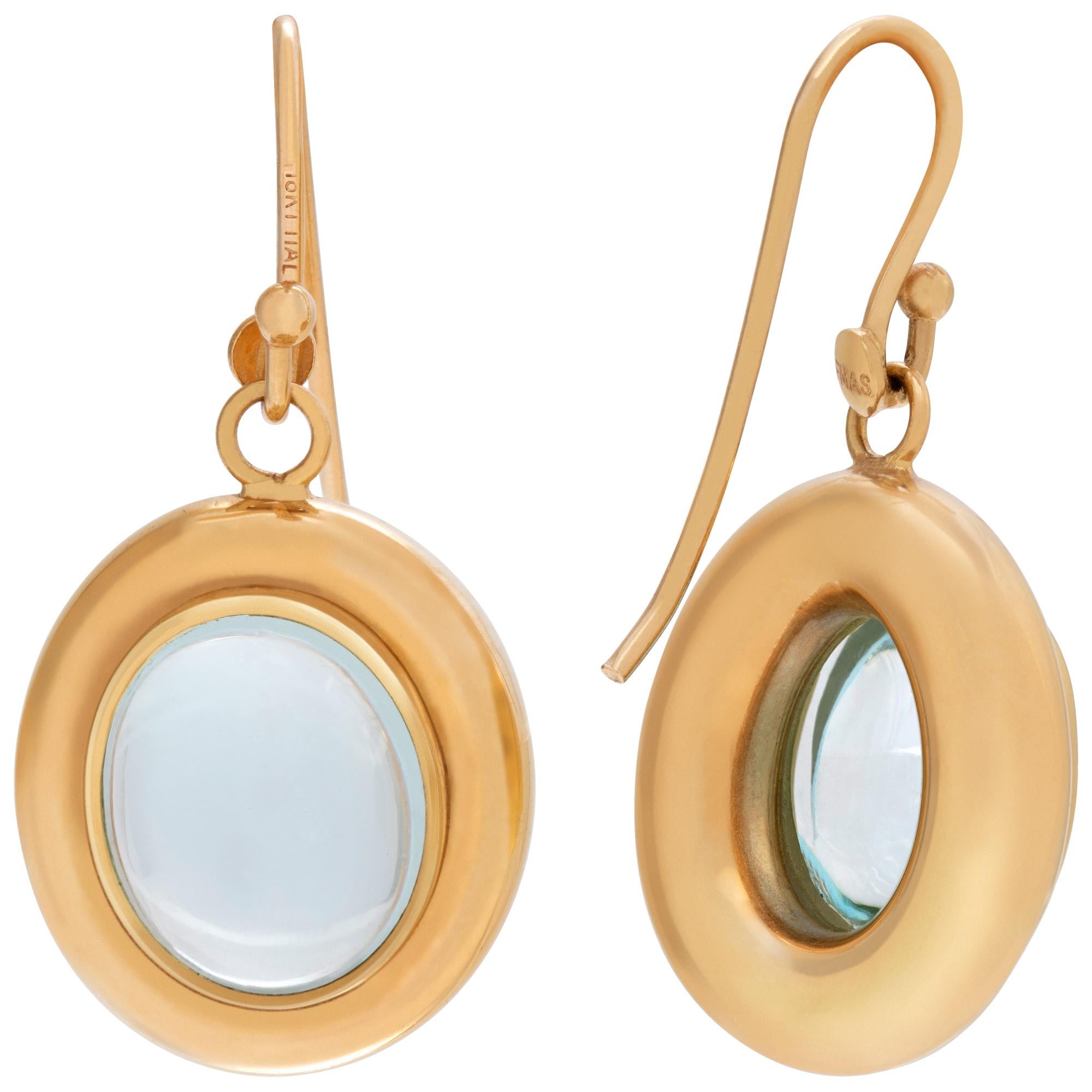Women's Blue Topaz earrings set in 14k yellow gold For Sale