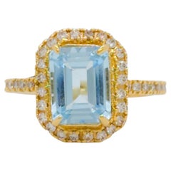 Blue Topaz Emerald Cut and White Diamond Cocktail Ring in 18k Yellow Gold