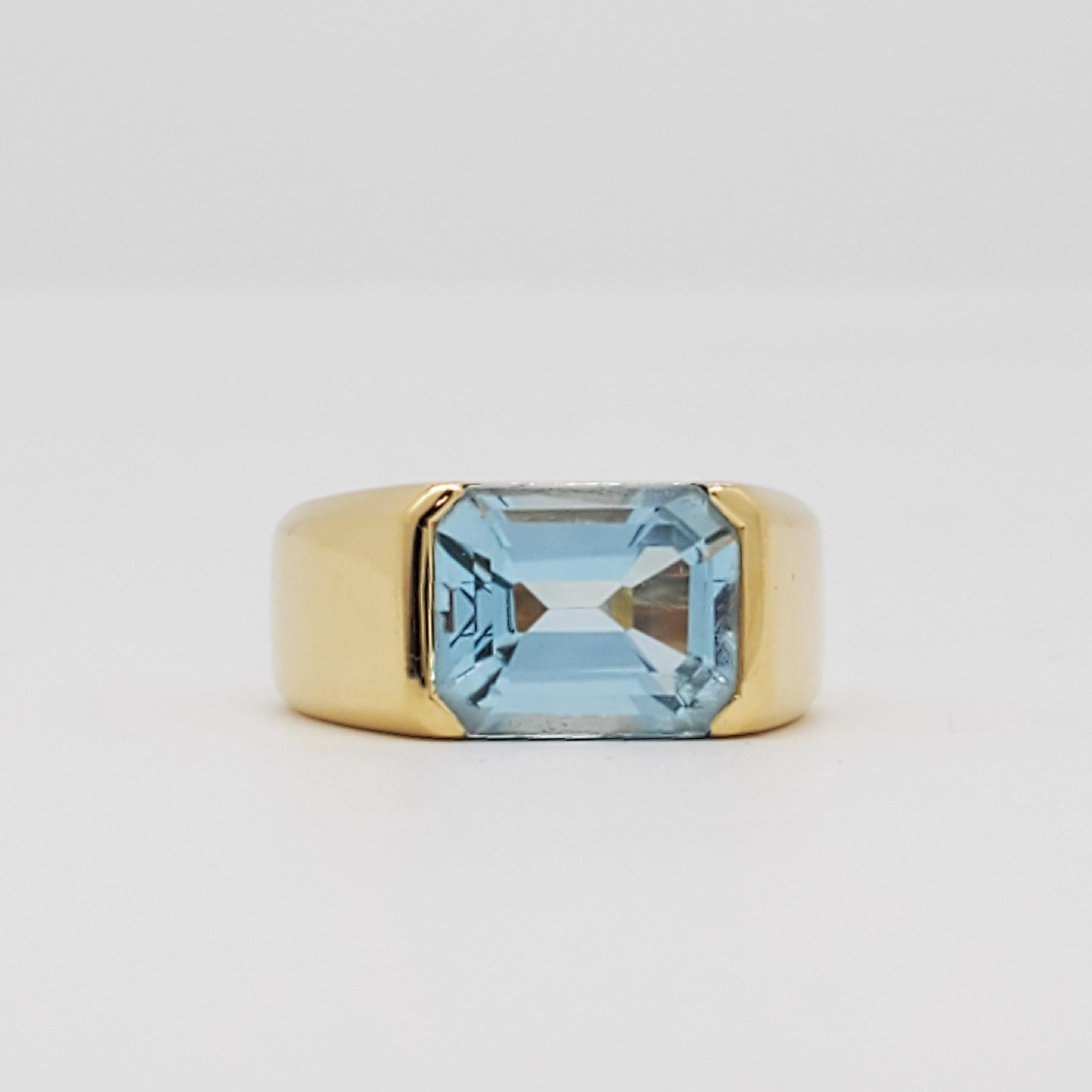 Gorgeous 3.50 ct. blue topaz emerald cut ring handmade in 18k yellow gold.  Ring size 4.5.